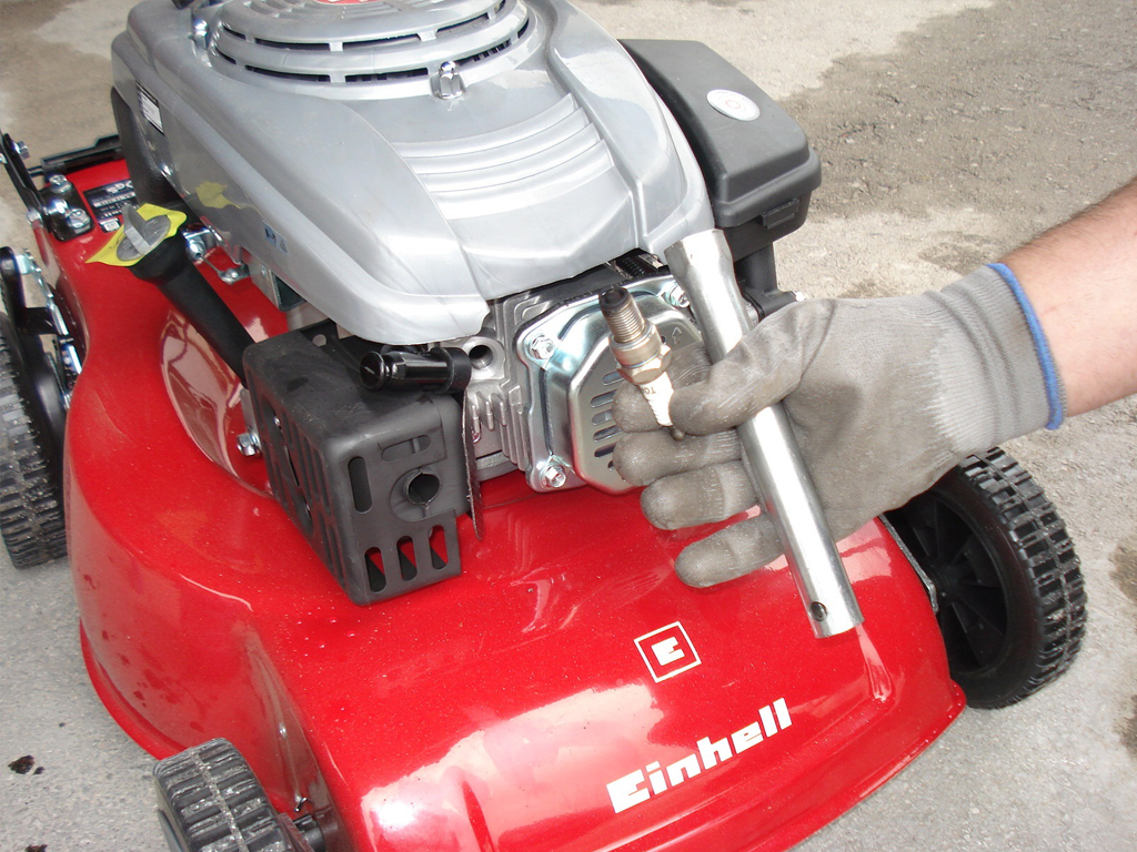 A broken spark plug that needs to be sanded down