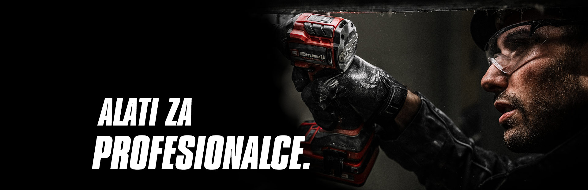 A hand holds a red cordless impact wrench being used on a metal beam, with the text "Power Tools for Pros".