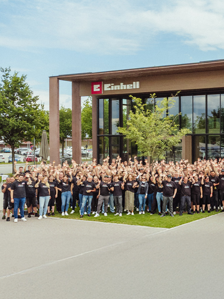 Einhell company building with employees symbolizing growth and success.