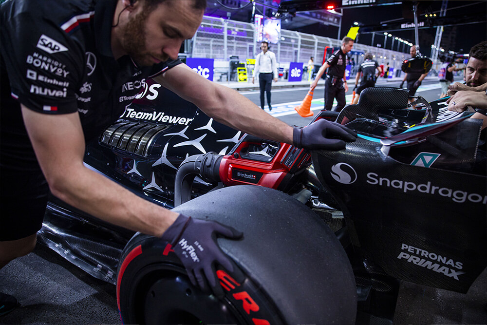 Formula 1 mercedes mechanic preparing the race car