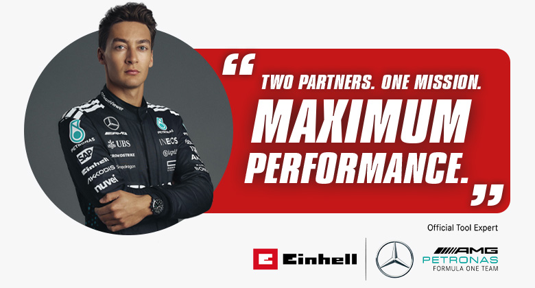 George Russell u trkaćoj opremi pored citata na crvenoj pozadini "Dva partnera. Jedna misija. Maksimalne performanse." i logotipa Einhell-a i Mercedes-AMG PETRONAS F1 Tima.