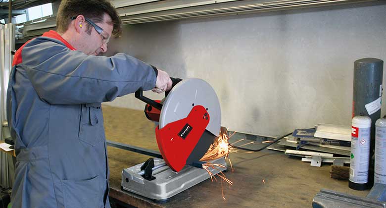 man working with a metal cutting saw